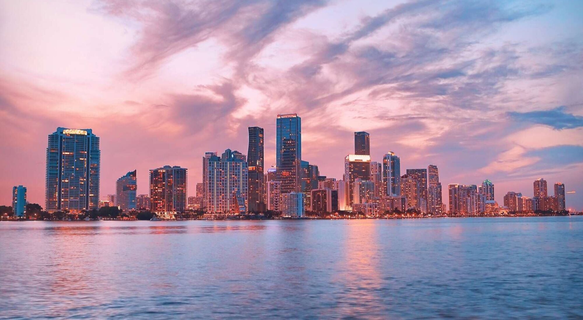 The Miami skyline at sunset seen from Biscayne Bay