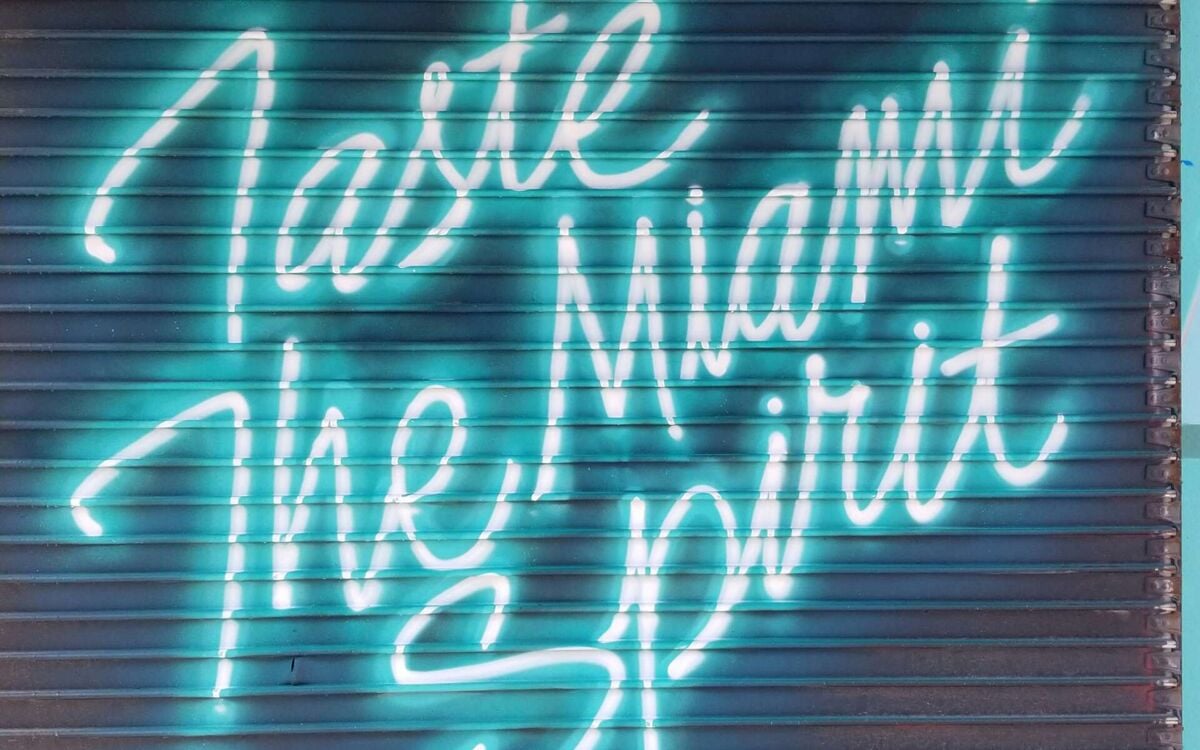 A neon sign reading Taste the Miami spirit in Wynwood